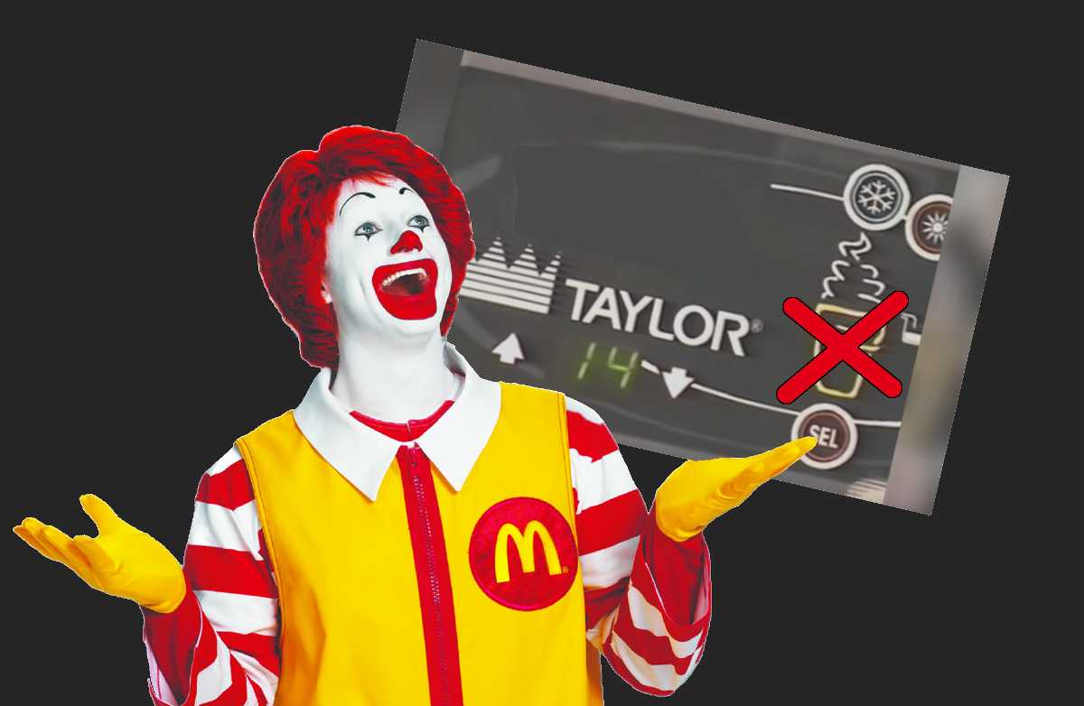 Obrazek przedstawiający Ronalda McDonalda, maskotkę sieci McDonalds, klauna w czerwono-żółtym stroju. Szeroko się uśmiecha. Za jego plecami wklejony wyświetlacz maszyny do lodów, na którym ikona loda w waflu jest zakryta czerwonym krzyżykiem.